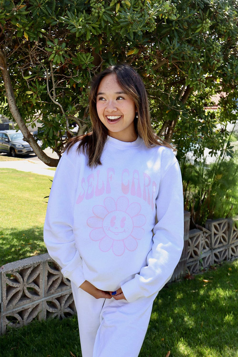 http://fanjoy.co/cdn/shop/products/nicole-laeno-merch-nicole-laeno-self-care-white-crewneck-29656124751981_1200x1200.jpg?v=1666814282