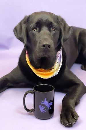 
                  
                    A dog with beautiful black fur sitting in front of the classic pets black mug
                  
                