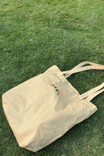 Yoora: Signature Sand Tote Bag